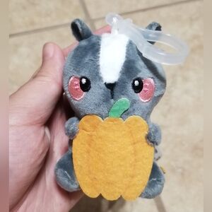 Honeymaru Trash Bandits Blind Box Series: Skunk With Pumpkin Bag Charm Plush